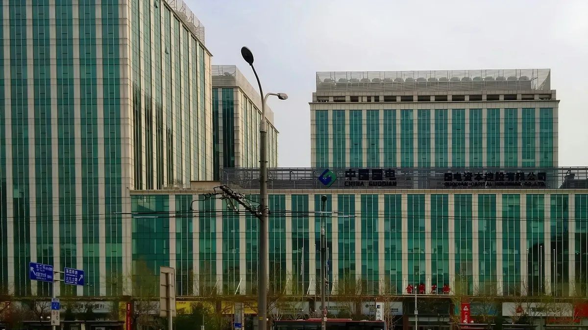 Modern commercial facility buildings with a green glass facade